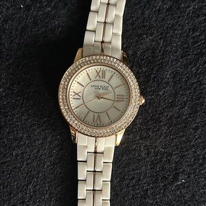 Anne Klein Gold and Cream Women's Watch  needs batteries
